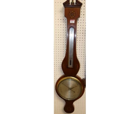 An early 19th century mahogany and conch shell inlaid two-dial wheel barometer, the lower scale signed Cetti &amp; Co., No. 2