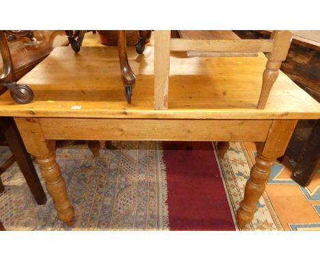 A pine round cornered farmhouse compact kitchen table, with single end drawer and raised on turned supports, length 121cm 