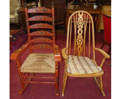 A red floral painted ladder back rush seat rocking elbow chair, together with a further beech wheel back rocking elbow chair 