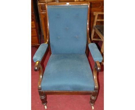 An early Victorian mahogany show frame scroll open armchair, having plain blue button back fabric upholstery raised on turned