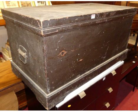 A circa 1900 black painted pine hinge topped tool chest, having iron end carry handles, w.93.5cm 