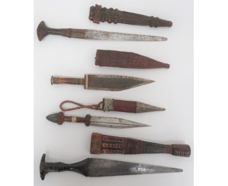 Four Various African Knives including 9 inch, double edged blade example. &nbsp;Leather covered grip. &nbsp;Contained in its 