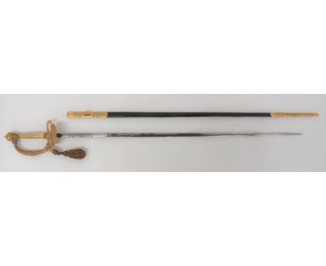 Post 1953 Court Dress Sword By Wilkinson 32 inch, double edged, narrow blade. &nbsp;Etched foliage scrolls and Queens crown E