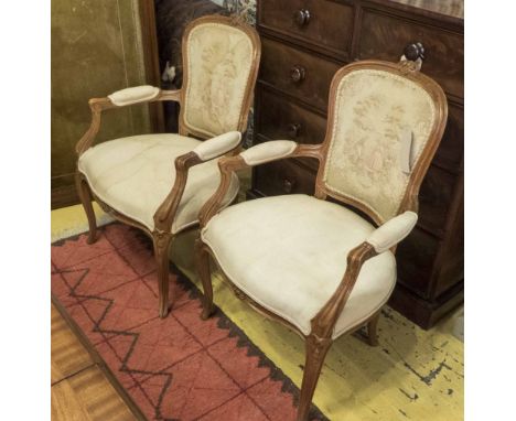 FAUTEUILS, a pair, Louis XV style beechwood with carved show and oval frames tapestry style backs, each 62cm x 93cm H. (2) (w