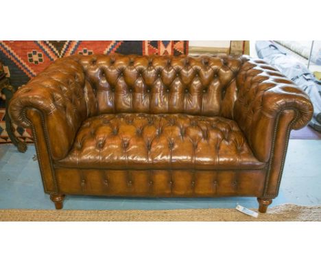 CHESTERFIELD SOFA, early 20th century, vintage, hand finished deep buttoned leaf brown leather upholstered with curved back a