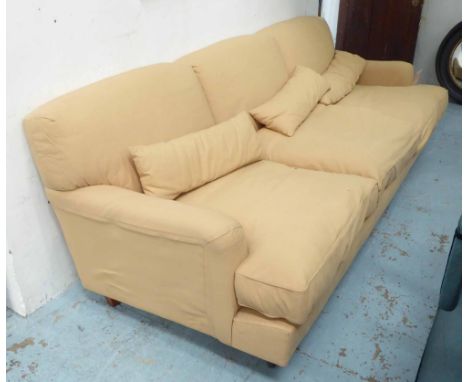 SOFA BY DE PADOVA, by Model 'Raffles', in tan, on detachable supports with castors, 96cm x 245cm, cost €6,000.