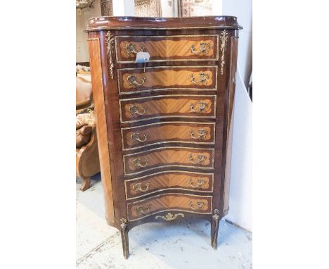 CORNER SEMAINIER, of hearth shaped cross section in mahogany with gilt metal mounts, seven concave drawers on cabriole suppor