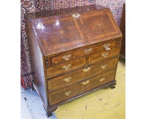 BUREAU, George II, oak, fruitwood and burr yewwood with stellar inlay, shaped fitted interior and well, on bracket supports, 