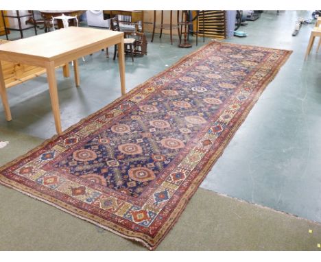 Long rectangular runner/rug, reds/blues pattern throughout, width 155 cm, length 500 cm  