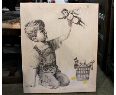 Canvas picture of little boy playing with toys 
