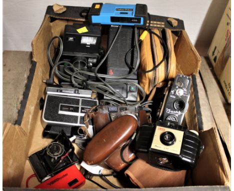 Box of vintage cameras and cine cameras - Kodak Disk 4000, Quartz M cine camera, Yashika Super YXL and Aikonta