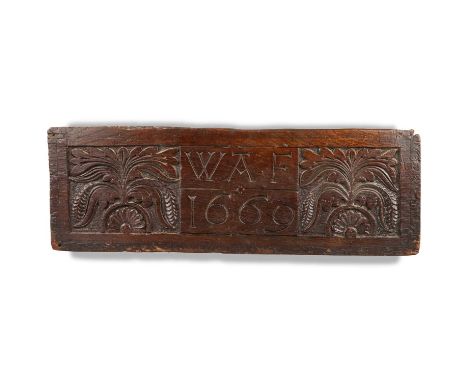 A CARVED OAK PANEL rectangular, carved with foliate panels each end, initialled 'WAF' and dated '1669' to the centre. 56.5cm 