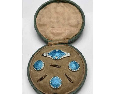 An Arts and Crafts silver gilt and enamelled button and brooch set, James Atkinson, Birmingham 1905, including three buttons,