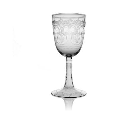 A Stourbridge engraved glass wine goblet, circa 1880, the large rounded bowl decorated with festoons and foliate C scroll bor