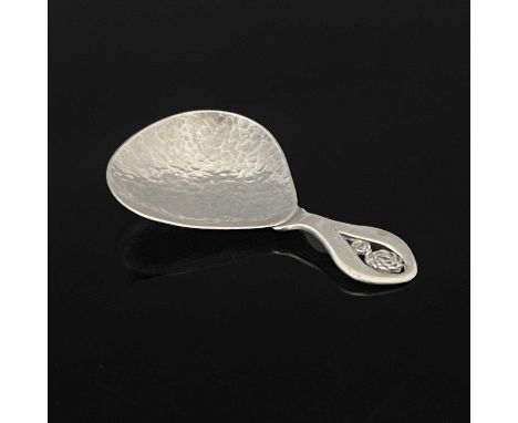 An Arts and Crafts silver caddy spoon, Winifred King and Co., Birmingham 1932, planished pear shaped bowl on an plain open ha