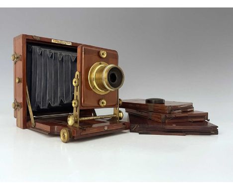 A J. Lancaster 1891 Instantograph Patent concertina Field camera, mahogany with brass fittings, blue bellows, with two sheet 