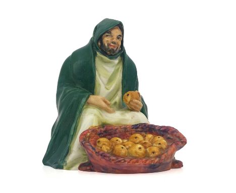 Charles Noke for Royal Doulton, An Orange Vendor, model HN 72, designed circa 1917, modelled in green cloak, painted marks, 1