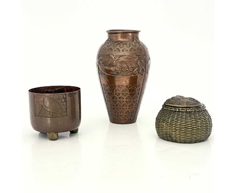 Three Arts and Crafts copper vessels, including a Newlyn style vase embossed with panels of fish in aquatic scenes, an inkwel