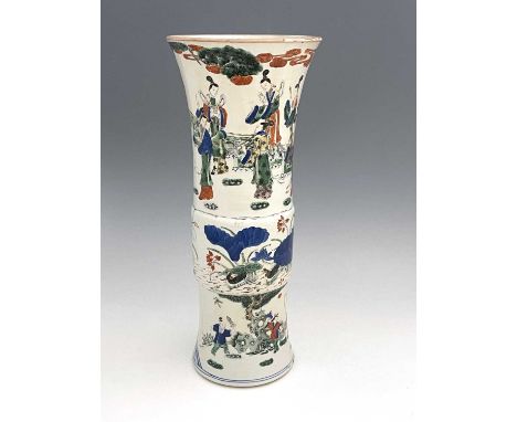 A Chinese Doucai Gu vase, cylindrical flared form, painted in the round with three bands, scholarly figures in a garden lands