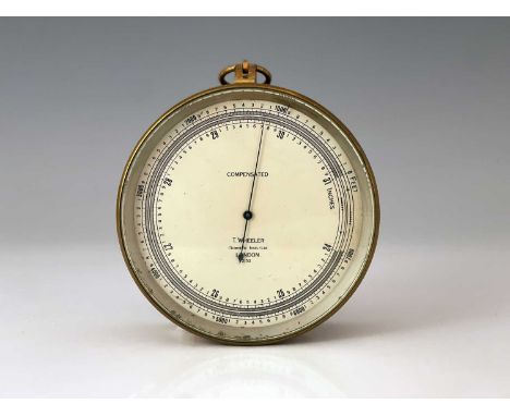 T. Wheeler, London, an early 20th Century Compensated brass military marine barometer, silvered dial, No.2152, broad arrow ma