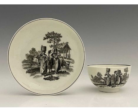 A Worcester black and white printed tea bowl and saucer, circa 1765, printed with the Milkmaid pattern, black borders, 12cm d