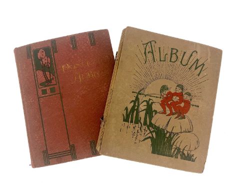 Two albums of early 20th century postcards, Mabel Lucie Attwell, Louis Wain, Lawson Wood etc.