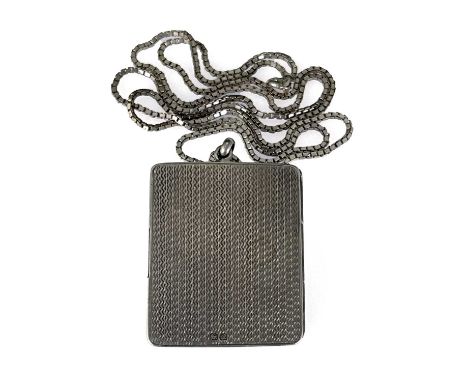 A George V silver pendant locket photo frame, Cohen and Charles, Chester 1917, rectangular form, engine turned barley corn te