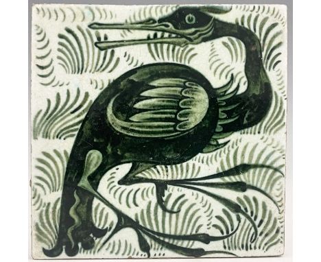 William De Morgan, an Arts and Crafts green Long Clawed Bird tile, circa 1900, painted with a cormorant on tufted ground, imp