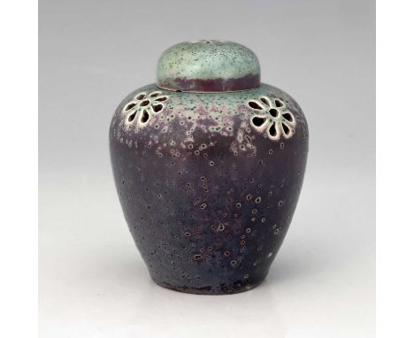 Ruskin Pottery, a small High Fired reticulated ginger jar and cover, circa 1905, pierced with six petal rosettes to the lid a