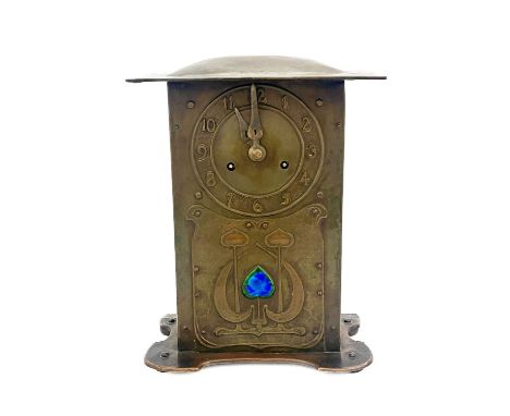 An Arts and Crafts copper and enamelled bracket clock, in the style of CFA Voysey, rivetted cuboid form, repousse embossed wi