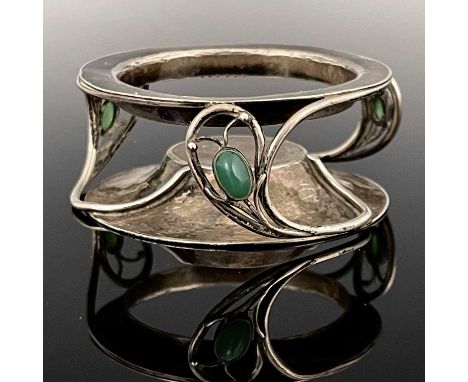 C R Ashbee for the Guild of Handicraft, an Arts and Crafts silver and chrysoprase set salt stand, London 1902, the planished 