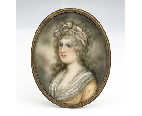 J. Brandl, an 18th-century portrait miniature painted to depict a young bewigged woman with striking blue eyes, indistinctly 