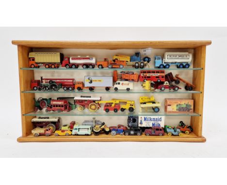 Display cabinet containing a collection of diecast vehicles including boxed Matchbox new 47 pannier locomotive, various loose