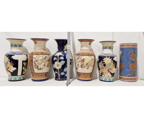 Five 20th century large Chinese-style pottery oviform vases and a cylindrical stick-stand, incised with dragons or sunflowers