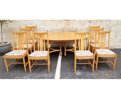 Ercol Golden Dawn dining suite&nbsp;comprising an oval extending dining table, raised on turned supports united by a bentwood
