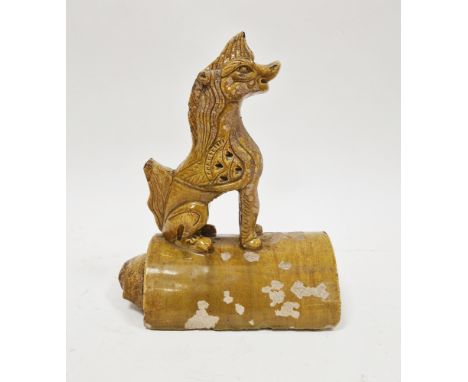 Chinese sancai ochre glazed terracotta roof tile surmounted by seated Pixiu, 26cm high&nbsp;