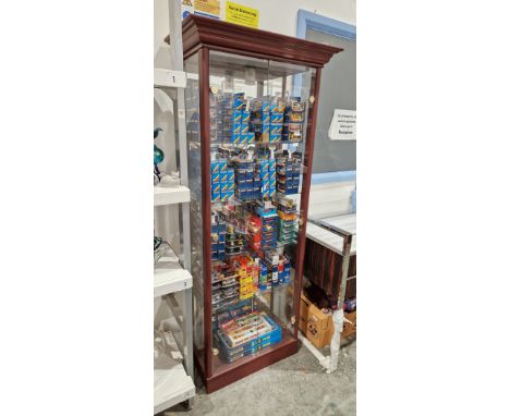 Modern wooden-effect glazed display cabinet, the two glass doors opening to an interior with light fittings, mirrored back an