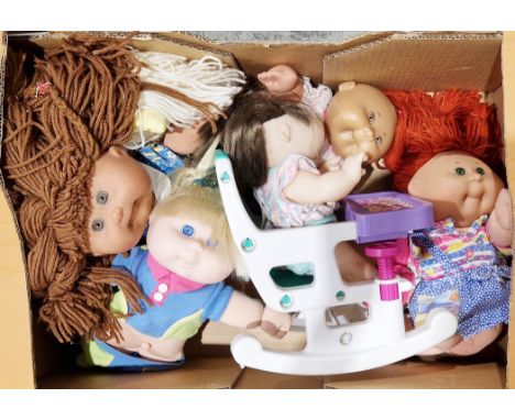 Cabbage Patch dolls - collection of seven Mattel Cabbage Patch dolls, including two first editions and one seated in a Cabbag