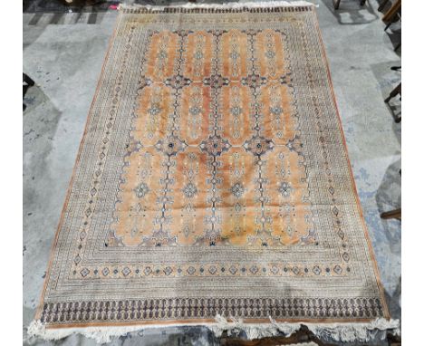 Kashmir (Shehraz) apricot&nbsp;ground lambs wool &amp; silk carpet, with two rows of three connected medallions dividing the 