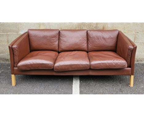 Danish brown leather three-seater sofa&nbsp;by Stouby, raised on square pale beech legs, 204cm long x 84cm deep x 83cm high&n
