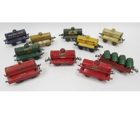 Nine Hornby tinplate '0' gauge tankers&nbsp;to include 'Motor Shell Spirit', 'Pratts', 'Shell Lubricating Oil', 'Esso' and a 