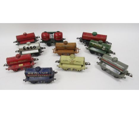 Nine Hornby tinplate tankers to include 'Shell', 'Pratts', 'Power', 'Esso' and 'Royal Daylight' and Hornby two barrel wine wa