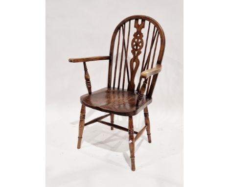 Elm and beech Windsor elbow chair, the hoop and stick back with wheel carved splat, 63cm wide x 15cm deep x 102cm high&nbsp;