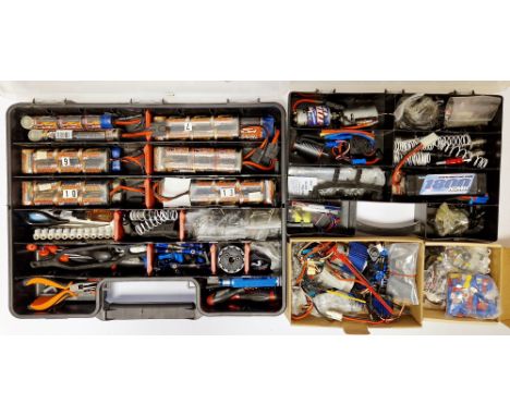 Large quantity of radio controlled car accessories, spare parts and tools to include a Traxxas TQi controller, electric motor