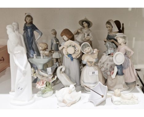 Lladro porcelain figure of a seated seamstress, Lladro porcelain figure of a young shepherd feeding a lamb, Nao porcelain gro