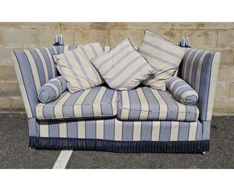 Knole style two-seater sofa&nbsp;with double drop arms, upholstered in a blue and cream striped fabric, with fringe, raised o
