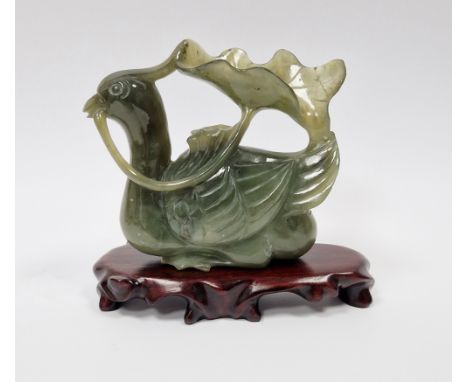 Chinese carved spinach jade model of a mandarin duck, 10cm high x 9.5cm wide and the carved hardwood stand&nbsp;
