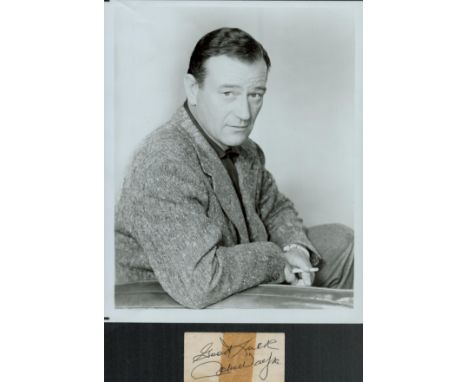 John Wayne signed 3x2 inch album page cutting and 10x8 inch vintage black and white photo. Good condition. All autographs com