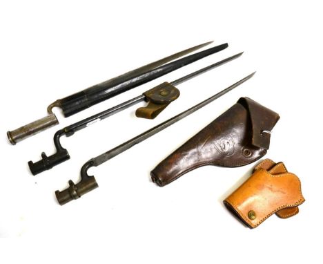 A US M1873 Socket Bayonet, with blued finish, with blued steel scabbard and leather frog; two Other Socket Bayonets, one numb