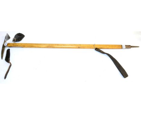 A Second World War Austrian Ice Axe by Stubai, the steel head stamped with maker's mark and dated 1942, with buckled black le